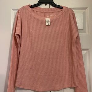 Never been worn with tags on cozy top!